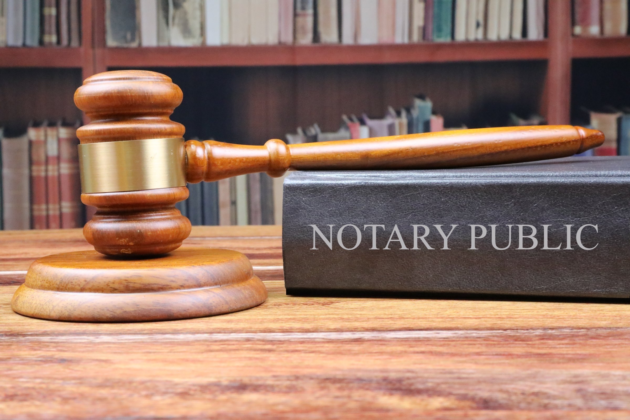 Gavel resting on notary journal